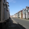 A third boarded-up street